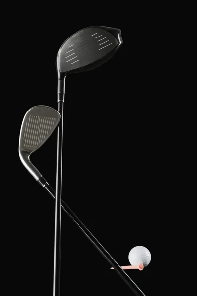 Close-up of golf clubs with a golf ball — Stock Photo, Image