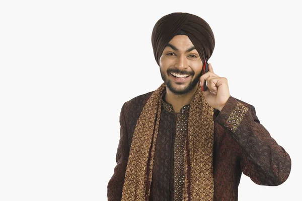 Sikh man talking on a mobile phone — Stock Photo, Image