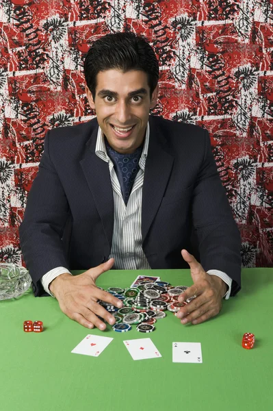 Man collecting won gambling chips — Stock Photo, Image
