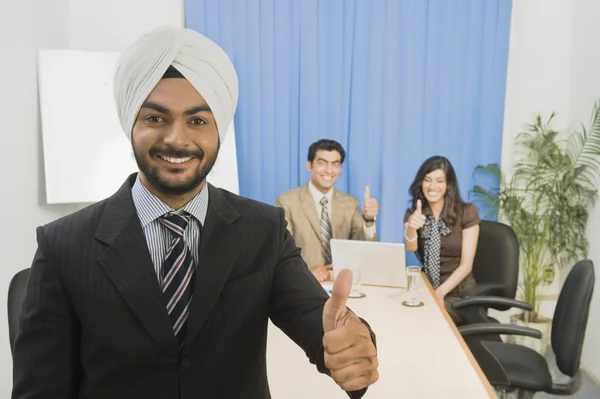 Business executives showing thumbs up — Stock Photo, Image