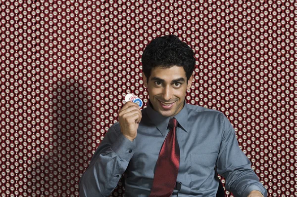 Man holding gambling chips — Stock Photo, Image