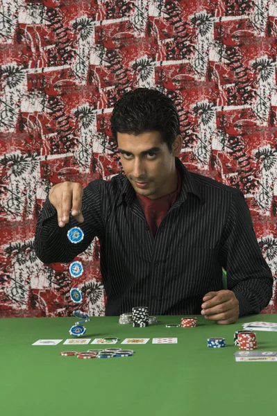 Man gambling in a casino — Stock Photo, Image