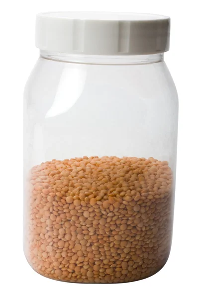 Close-up of red lentil in a plastic jar — Stock Photo, Image