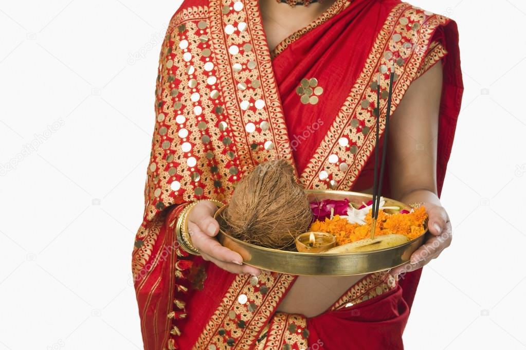 Woman holding religious offering