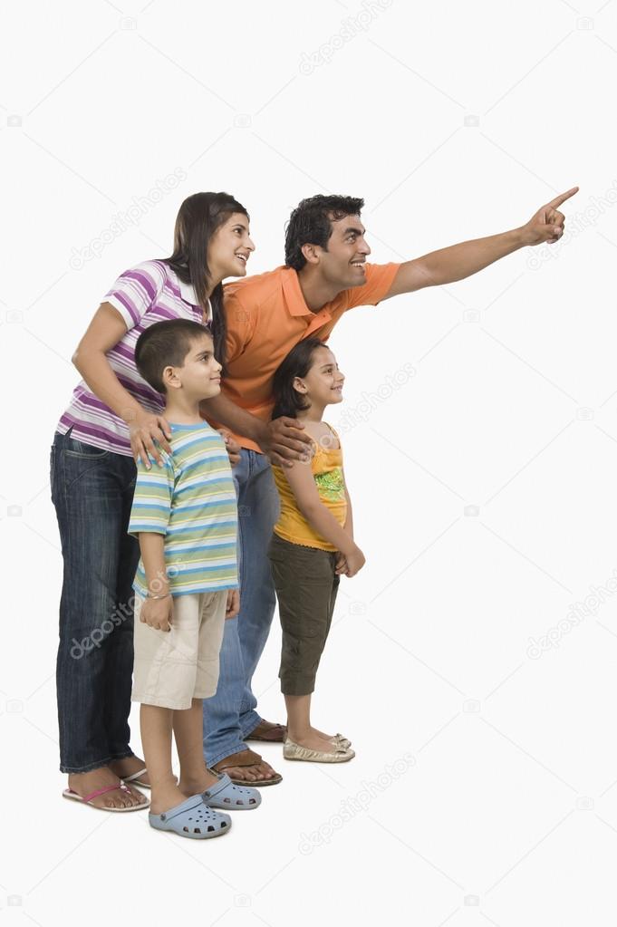 Parents with their children pointing