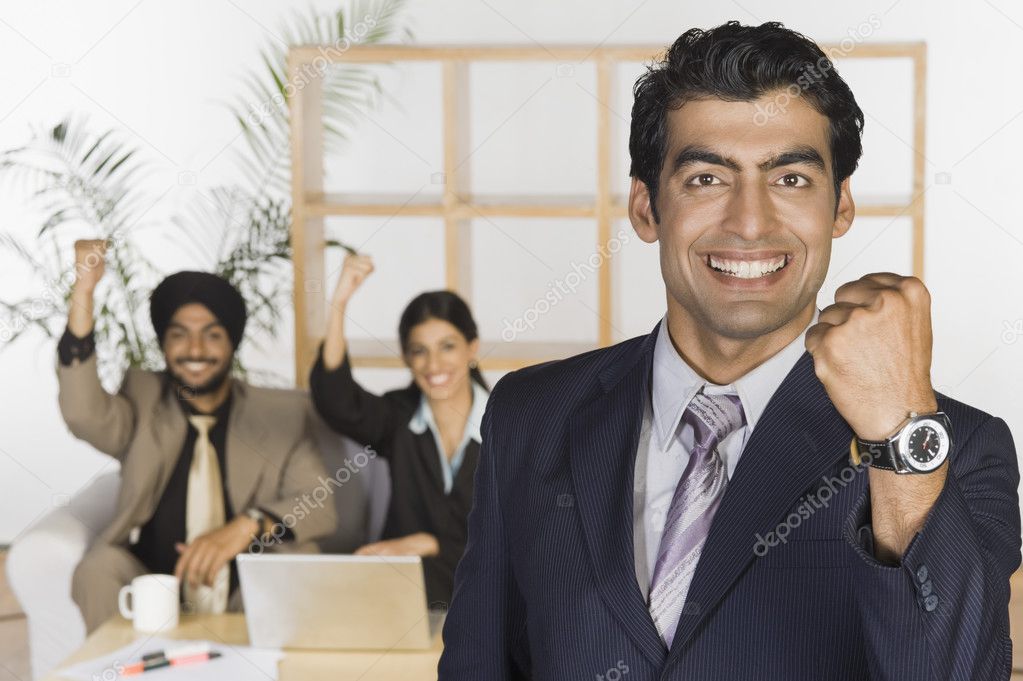 Business executives showing fist