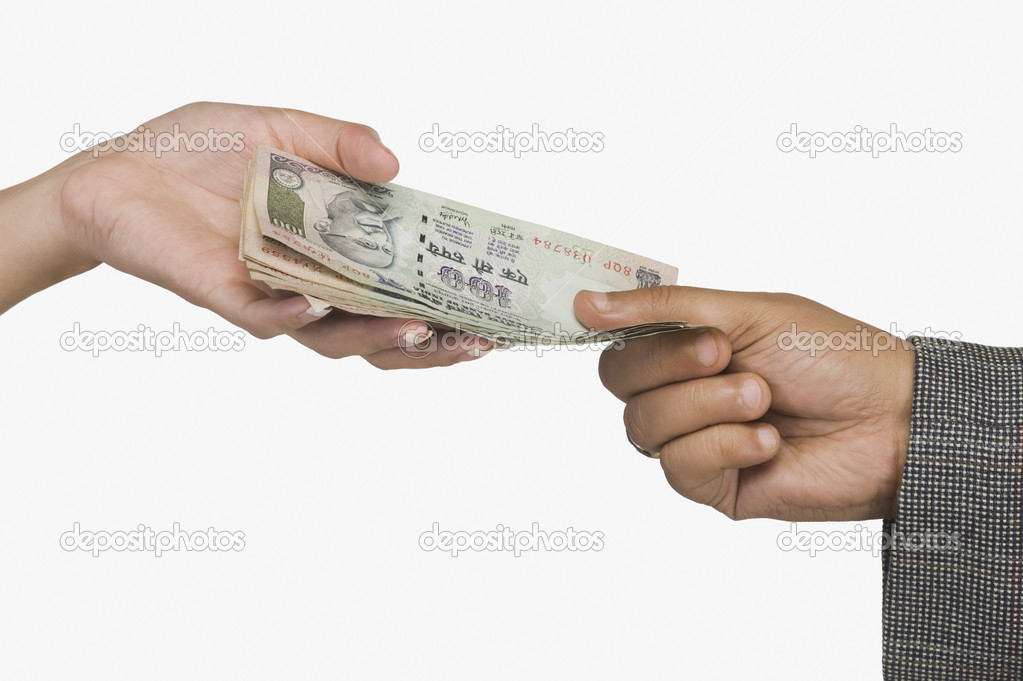 Woman giving money to a man