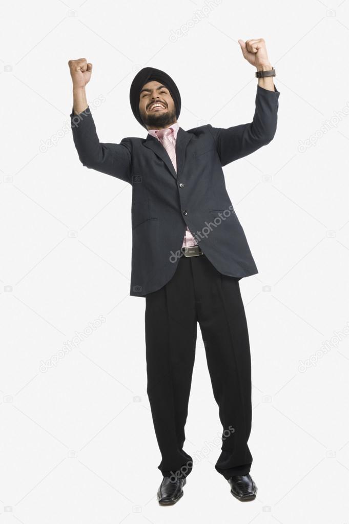 Businessman with his arms raised