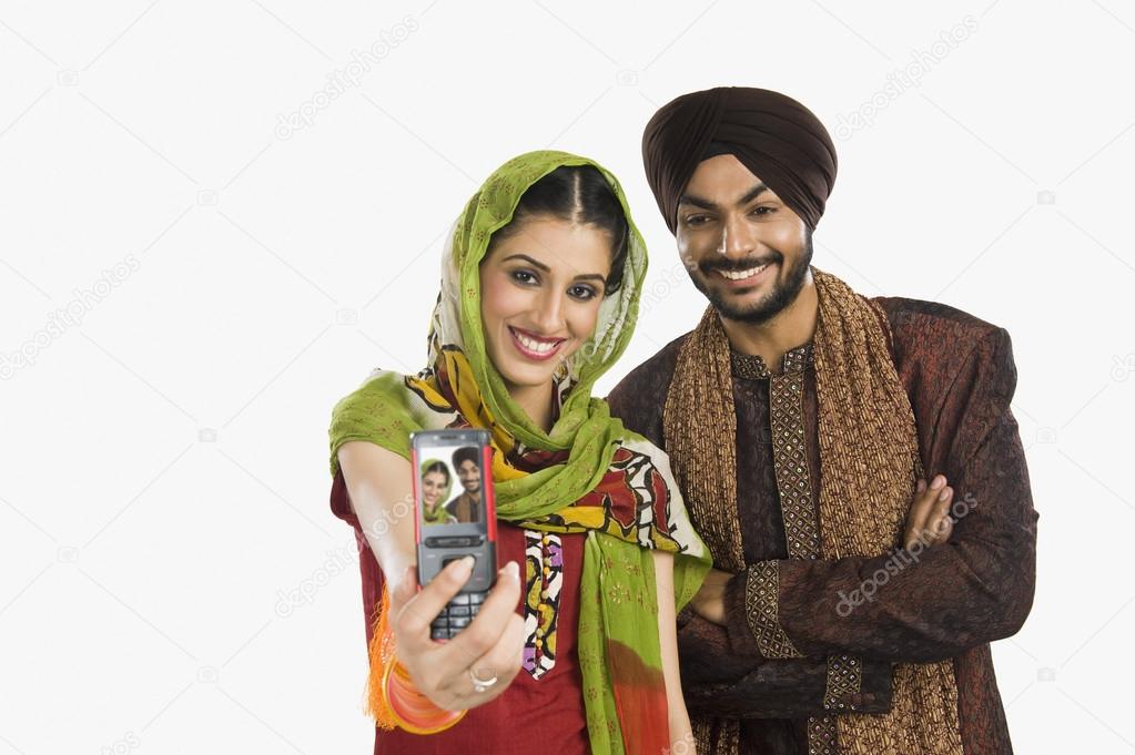 Sikh couple taking a picture of themselves