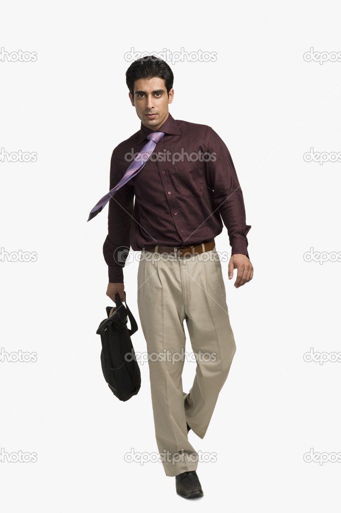 Businessman pulling a bag