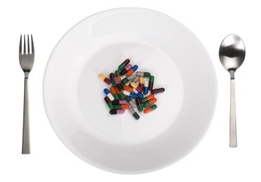 bir tabak içinde çeşitli kapsül