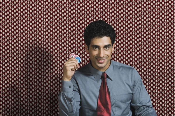 Man holding gambling chips — Stock Photo, Image