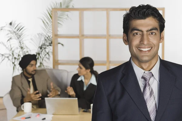 Businessman with his colleagues — Stock Photo, Image