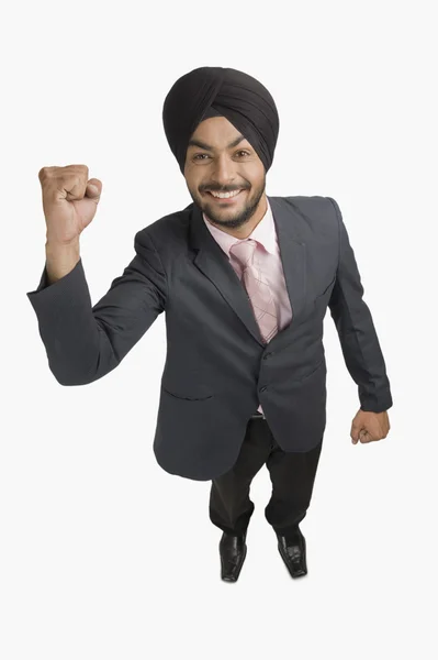 Businessman smiling with his hand raised — Stock Photo, Image