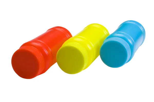 Close-up of colorful plastic jars — Stock Photo, Image