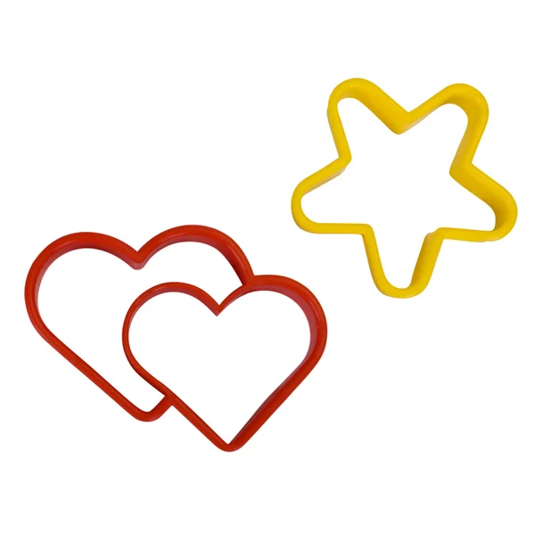 Close-up of a star and a heart shaped cookie cutters — Stock Photo, Image