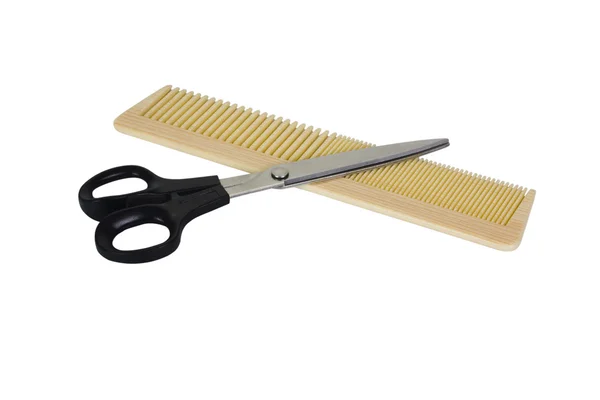 Close-up of a comb with scissors — Stock Photo, Image