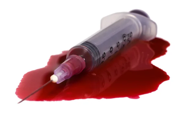 Blut mit einer Spritze — Stockfoto