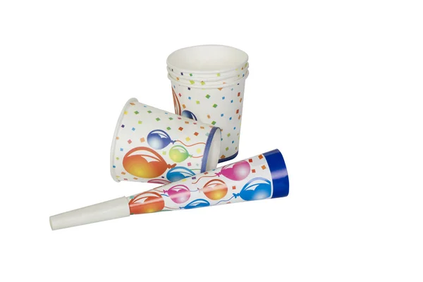 Close-up of disposable cups with a party horn blower — Stock Photo, Image