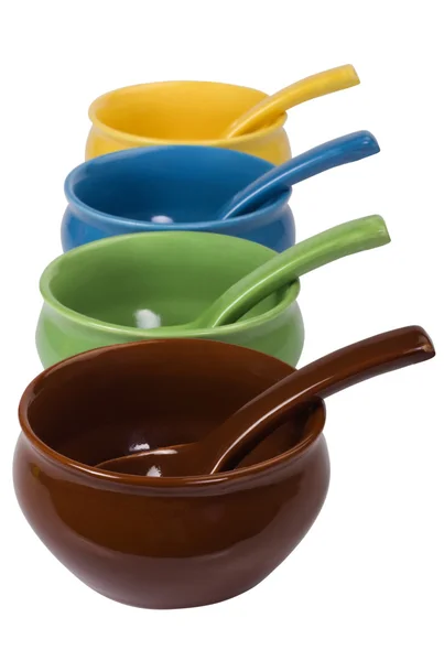 Close-up of ceramic bowls and soup spoons — Stock Photo, Image