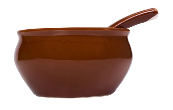Primo piano di una ciotola di ceramica con un cucchiaio da minestra — Foto Stock