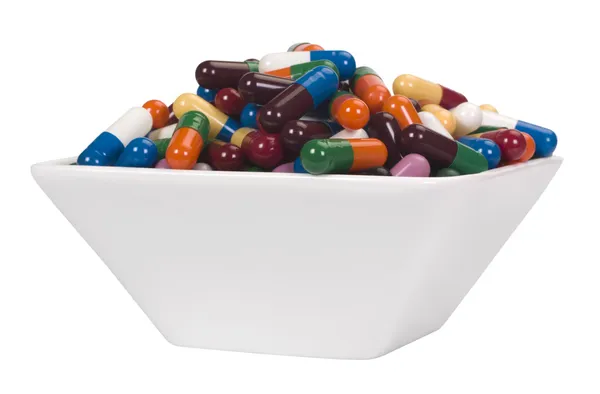 Close-up of a bowl of capsules — Stock Photo, Image