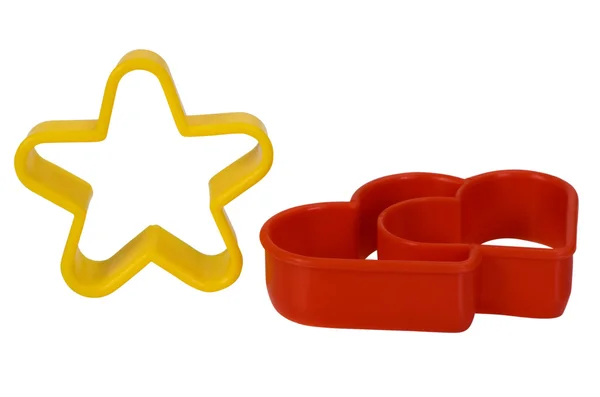 Close-up of a star and a heart shaped cookie cutters — Stock Photo, Image