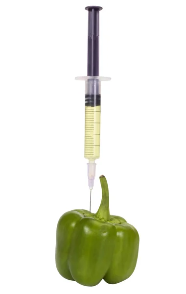 注射器で注入される緑のピーマン ロイヤリティフリーのストック写真