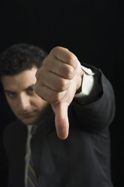 Businessman showing thumbs down sign — Stock Photo, Image