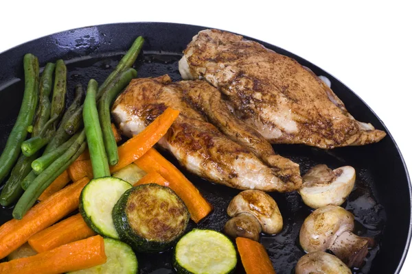 Chicken breasts with vegetable on a griddle — Stock Photo, Image