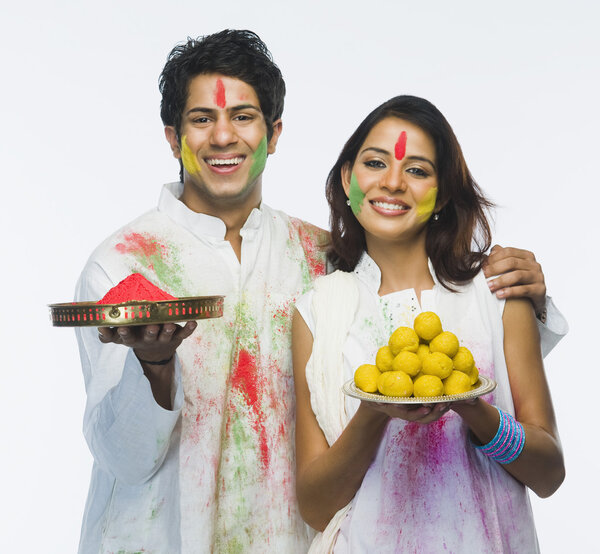 Couple celebrating Holi Stock Photo
