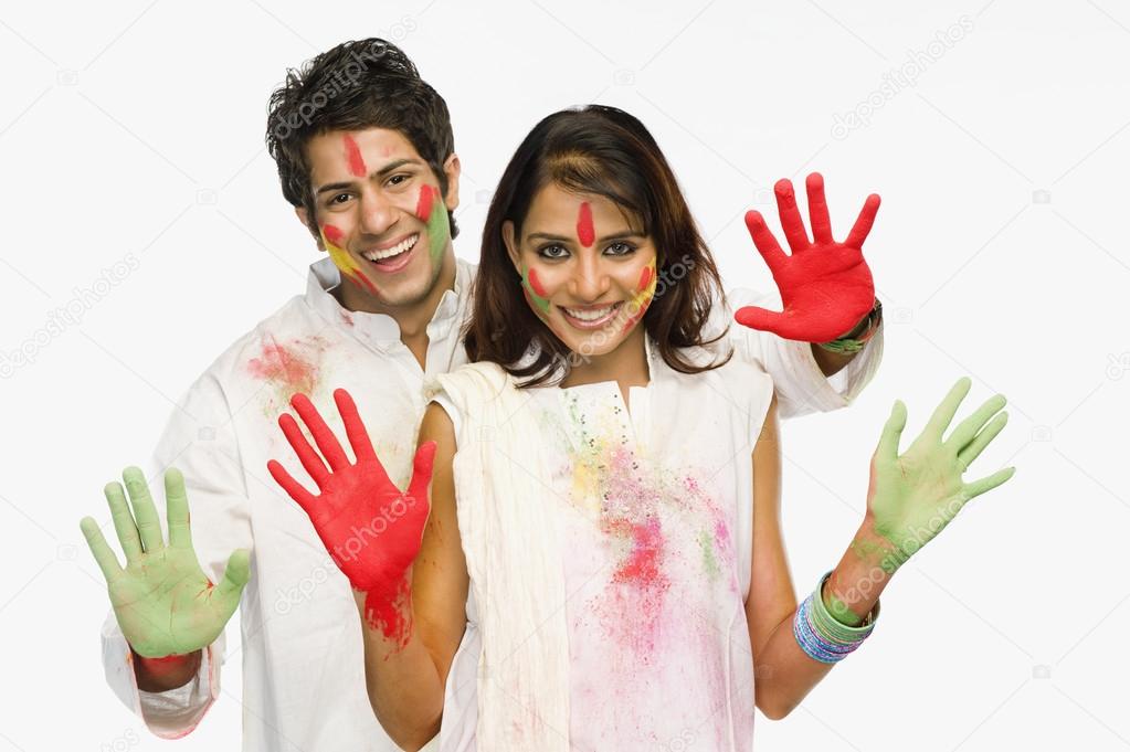 Couple showing their colored hands