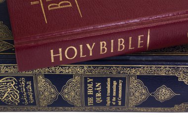 Close-up of the Koran and the Bible clipart