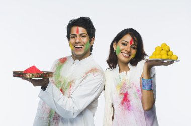 Couple celebrating Holi clipart
