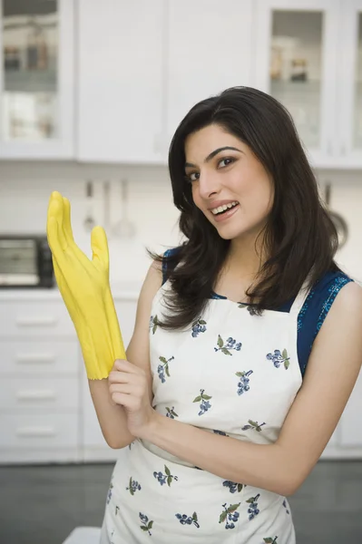 Woman wearing rubber gloves — Stock Photo, Image