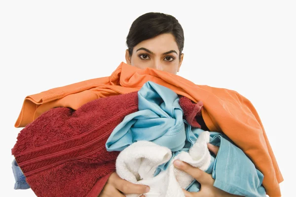 Woman holding clothes — Stock Photo, Image