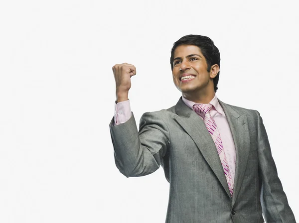 Businessman clenching fist in excitement — Stock Photo, Image