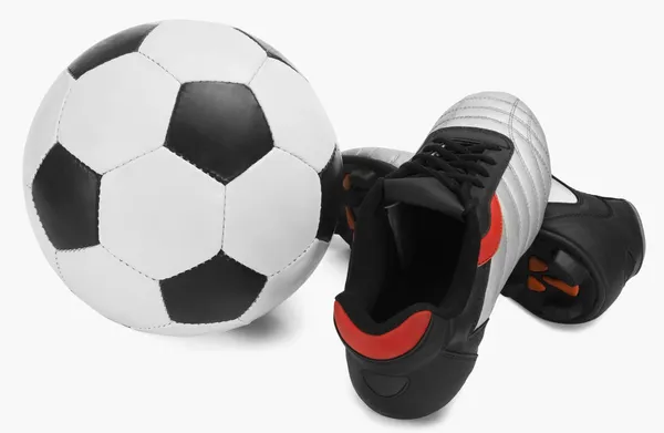 Voetbal met een paar schoenen — Stockfoto