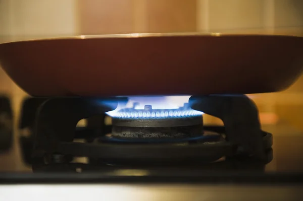 Pan on a gas stove burner — Stock Photo, Image