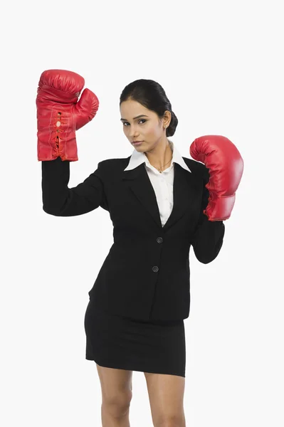 Businesswoman in boxing gloves — Stock Photo, Image