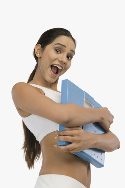 Woman holding a weight scale — Stock Photo, Image