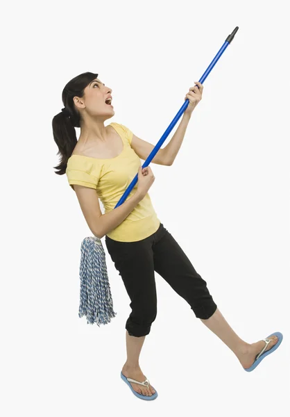 Woman dancing with a mop — Stock Photo, Image