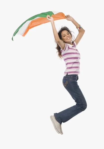 Woman jumping with an Indian flag — Stock Photo, Image