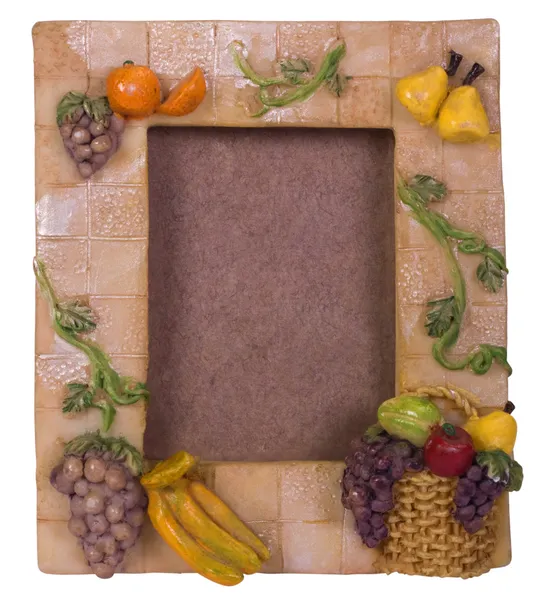Close-up of a picture frame decorated with artificial fruits — Stock Photo, Image