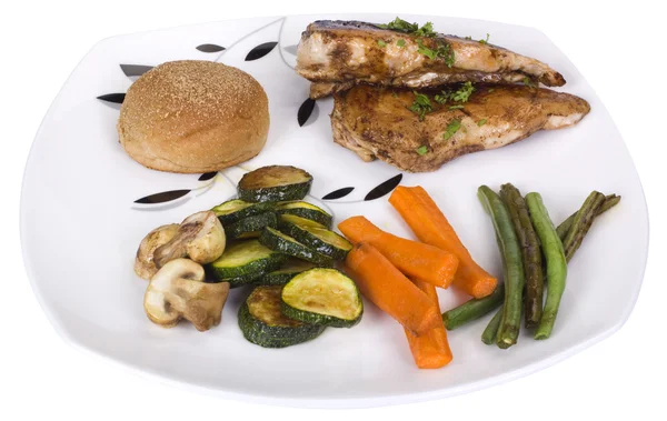 Chicken breast with bread and vegetables on a plate — Stock Photo, Image