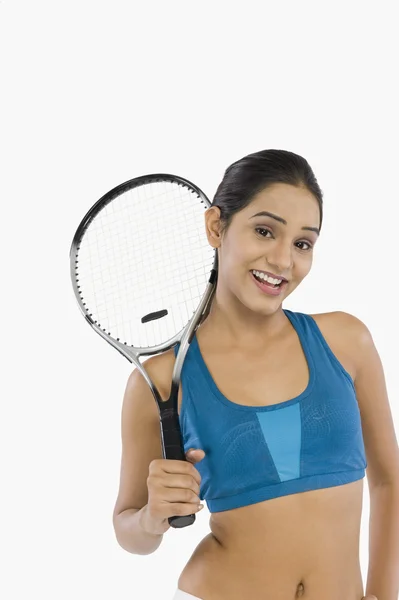 Woman holding a tennis racket — Stock Photo, Image