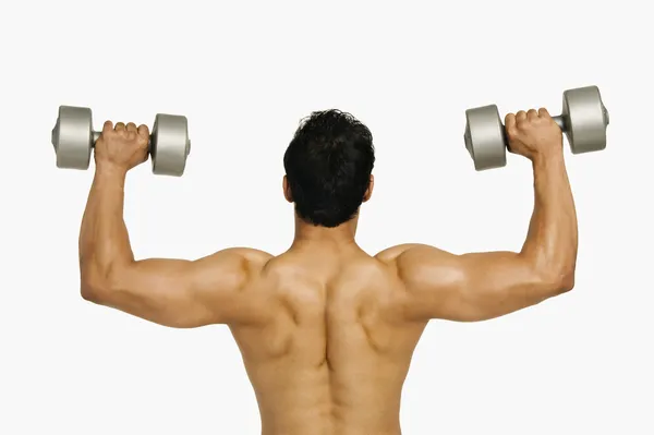 Man exercising with dumbbells — Stock Photo, Image