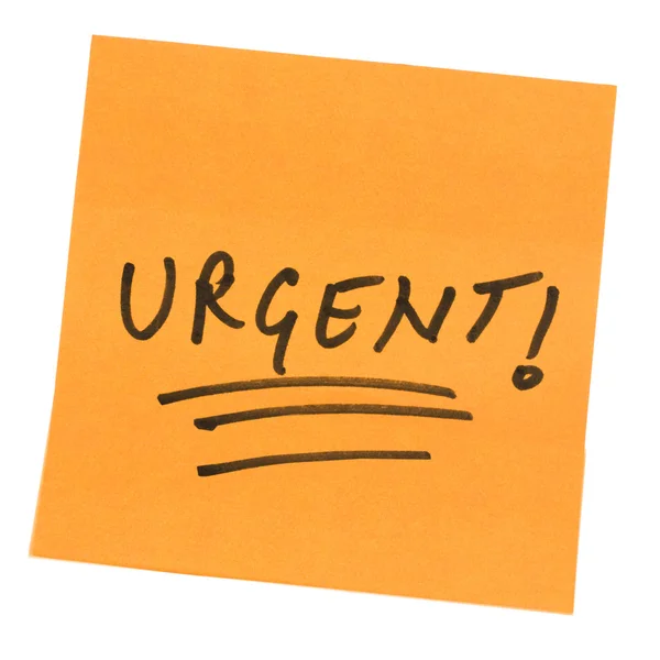 Word Urgent written on an adhesive note — Stock Photo, Image