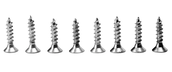 Close-up of screws arranged in a row — Stock Photo, Image