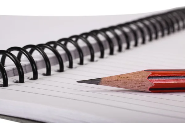 Close-up of a pencil on a spiral notebook — Stock Photo, Image